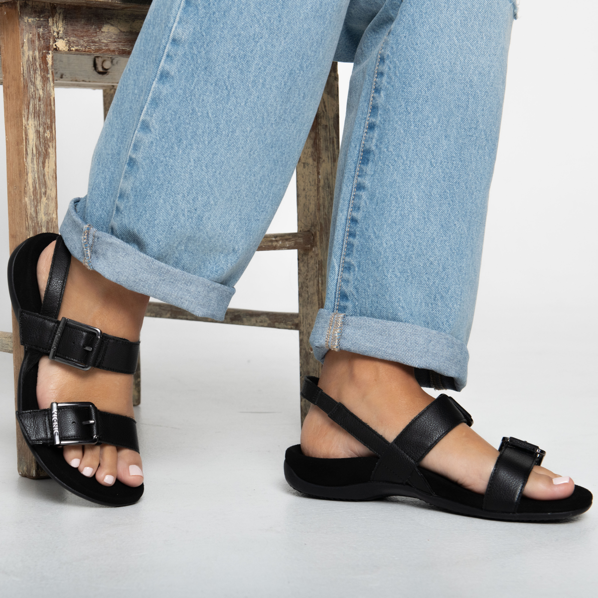Woman wearing Vionic Reese sandals in a spring lifestyle setting